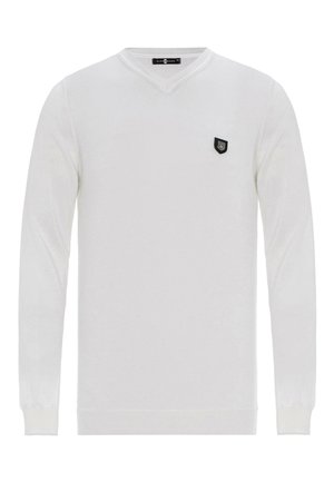 Weißer langärmeliger V-Ausschnitt-Pullover aus weichem Material. Verfügt über ein kleines, schwarzes Wappen-Logo auf der linken Brust.