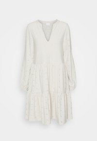 Robe beige clair avec un décolleté en V et de longues manches bouffantes. Design à volants avec broderies florales et taille froncée. Texture de tissu douce.