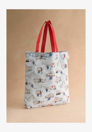 Light blue tote bag with red handles, featuring cartoon-style illustrations of people, dogs, buildings, and vehicles in various activities.