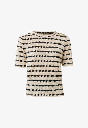 Short-sleeve knit top in cream with zigzag stripes in black and brown, featuring two gold buttons at the shoulder and a round neckline.
