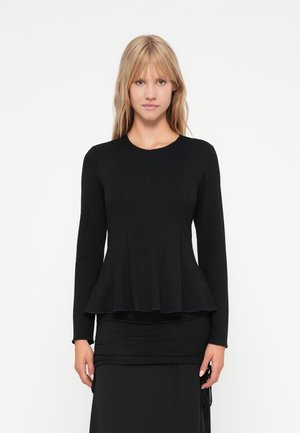 Haut noir à manches longues avec un col rond, corsage structuré et ourlet peplum. Fabriqué en tissu doux avec une texture lisse.