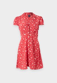 Rotes Blumenkleid mit kurzen Puffärmeln, durchgehender Knopfleiste und V-Ausschnitt. Der Stoff ist mit kleinen weißen Blumen und grünen Akzenten bedruckt. A-Linie Silhouette.