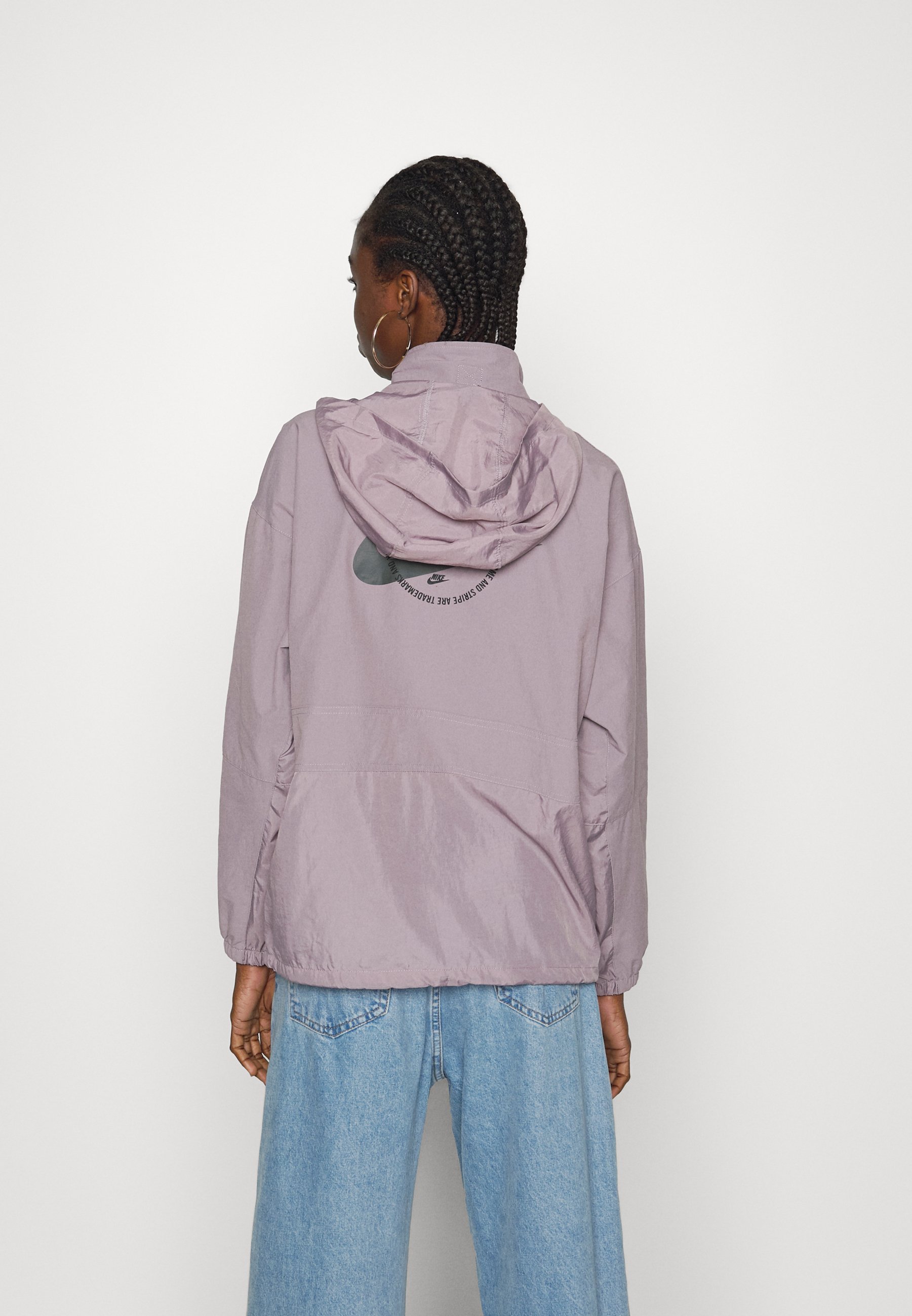 Nike Sports Utility Graphic Packable Quarter Zip Jacket in Purple
