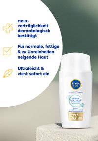 Sunscreen bottle with a white plastic body, rounded cap, and blue label. Features UV protection info and dermatological certification icons.