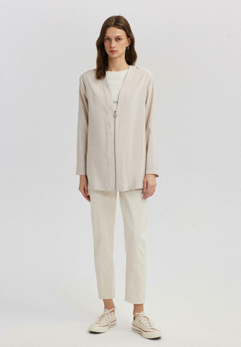 Touché Privé Jas graniet