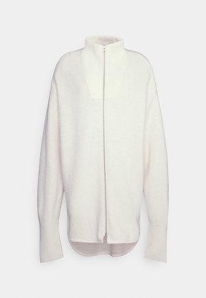 Rits trui van zacht witte stof, met een hoge hals, geribbelde details en een relaxte pasvorm met lange mouwen en een ronde zoom.