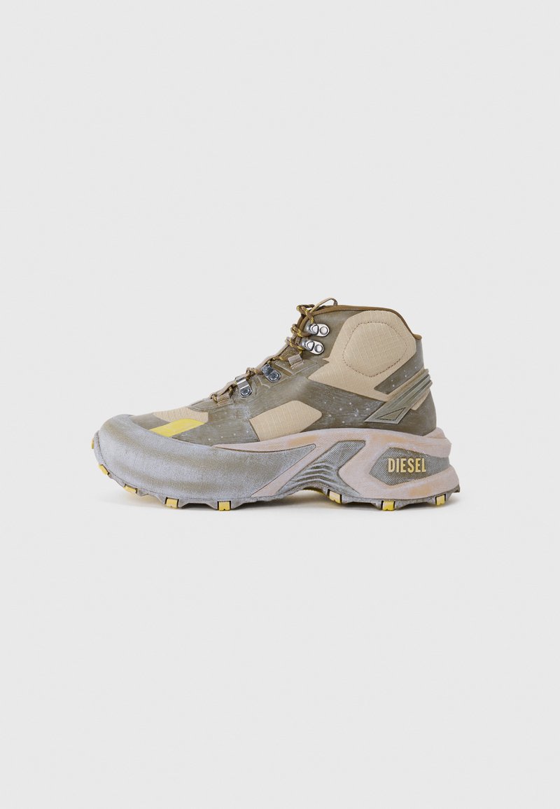 Tan and gray mid-top sneaker with textured panels, metal eyelets, and yellow accents on the sole and lateral sides. Branding on heel.