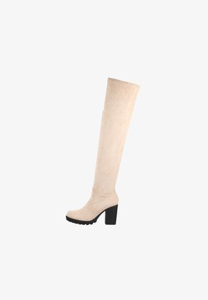 Bottes beige au-dessus du genou en daim, avec un talon bloc, une semelle en caoutchouc et un design épuré avec des détails de coutures minimaux.