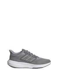 Scarpe sportive grigie con parte superiore in mesh traspirante, tre strisce grigio scuro, contrafforte del tallone sagomato e suola bianca testurizzata.