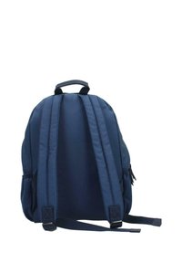 Navy blue backpack with a rounded shape, padded shoulder straps, and a top handle. Features a zippered pocket and visible stitching details.