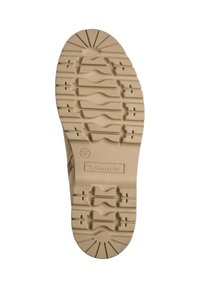 Semelle de chaussure en caoutchouc beige avec des motifs de texture et des rainures. Marquée du "37" et du logo "Tamaris". Design de pointe arrondie.