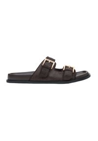 Brown slide sandal with two adjustable buckles, made from textured material, featuring a flat rubber sole and a minimalist design.