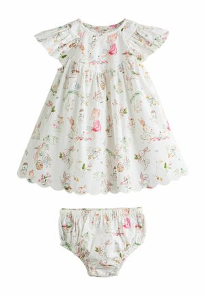 White baby dress with scalloped hem and matching diaper cover, printed with playful animals, flowers, and children in pastel colors.