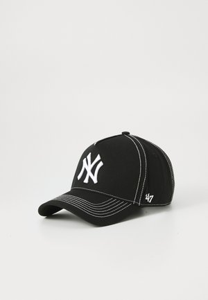 Black baseball cap featuring a prominent white New York Yankees logo and white stitching details, displayed on a light background.