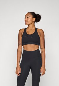 Champion SOFT TOUCH BRA LIGHT SUPPORT WITH LARGE LOGO - Sport-bh met light support - black