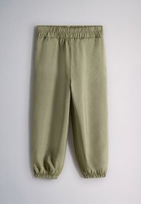 Pantalon jogger vert olive avec taille et chevilles élastiques, en tissu doux, présenté à plat sur fond clair.