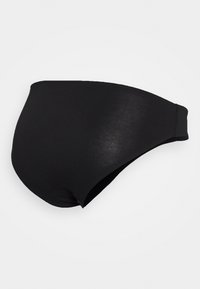 Parte inferior de biquíni preta com design sem costura, cintura média e tecido elástico suave com uma textura lisa e sem padrões visíveis.