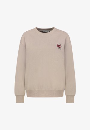Beiges Sweatshirt mit rundem Ausschnitt und langen Ärmeln. Verziert mit einer kleinen roten und rosa gestickten Rose auf der linken Brust. Glatte Textur.