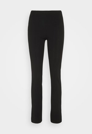 Swarma leggings i stretchigt tyg med en åtsittande design och raka ben. Inga synliga sömmar eller utsmyckningar, slät textur.