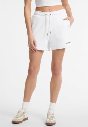 White cotton blend shorts with an elastic waistband, drawstring, side pockets, and embroidered logo on the hem. Smooth texture.