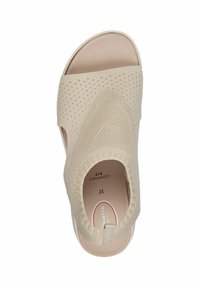 Beige nyitott orrú szandál texturált kötött felsőrésszel, elasztikus pánttal és párnázott talppal. Simma talppal és minimális dizájn akcentusokkal rendelkezik.