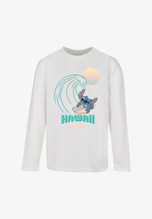 Langærmet hvid t-shirt med en tegneseriefigur på et surfbræt, en bølge og teksten "HAWAII aloha" i turkise og ferskenfarvede nuancer.