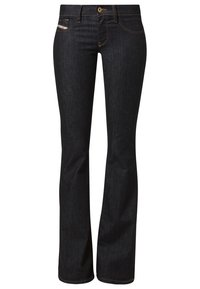 Ciemnoniebieskie dżinsy typu flare z zamkiem błyskawicznym i zapięciem na guzik. Posiadają pięć kieszeni oraz subtelne akcenty w postaci przeszyć. Gładka tekstura.