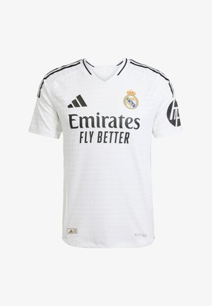 Bílý fotbalový dres s černými akcenty, brandingem "Emirates Fly Better" a klubovým znakem. Obsahuje design s výstřihem do V a texturovanou látku.