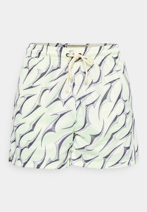 Menta zöld úszónadrág hálós textúrával, fekete absztrakt lángmintázattal, rugalmas derékpánttal és zsinóros részlettel.