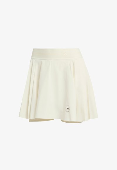 Gonna plissettata color crema con una texture morbida, vita elastica e dettaglio con logo circolare vicino all'orlo. Materiale in misto cotone; lunghezza a metà coscia.