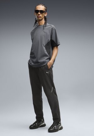 Puma, PUMATECH - Pantalon de survêtement - black
