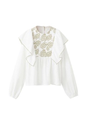 Blouse blanche à manches longues, dotée d'un col à volants et d'une broderie florale dorée sur le buste avec une texture froncée en dessous.