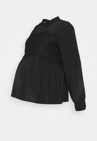 Czarna bluzka ciążowa z długimi rękawami, wysokim kołnierzem i koronkowym wykończeniem na tułowiu. Wykonana z gładkiego materiału, o zwiewnym kroju.
