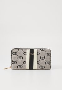 Zip-around wallet made of patterned fabric in grey and black, featuring a gold logo, black and white stripes, and a polished hardware accent.