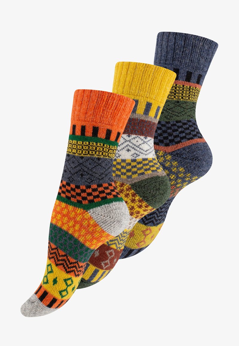 Three pairs of patterned socks featuring vibrant colors: orange, yellow, green, navy, and gray. Each sock has distinct geometric designs and textures.