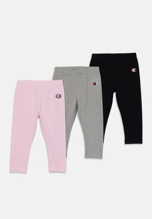 Tres pares de leggings en rosa, gris y negro. Hechos de suave algodón, con una cinturilla elástica y un pequeño logo en la parte frontal.