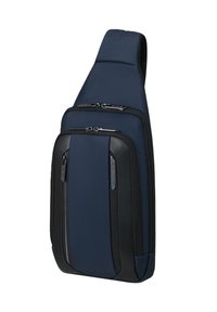 Zaino a tracolla blu navy con tessuto testurizzato, accenti neri, due tasche con zip e spallacci imbottiti per il massimo comfort.