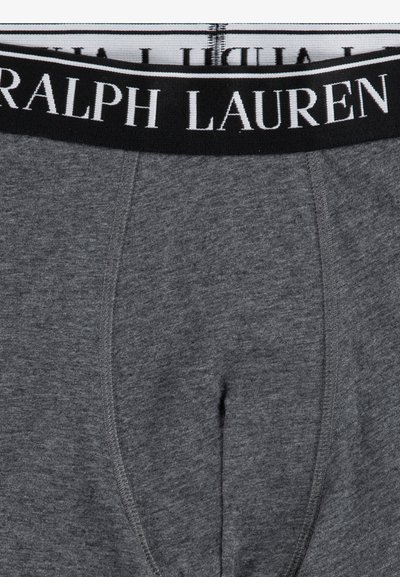 Bóxer de algodón gris con una cinturilla elástica que presenta el logo "RALPH LAUREN" en blanco. Muestra una textura suave y un diseño simple.