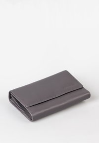 Gray leather wallet with a flap closure, featuring smooth texture and subtle stitching details. Compact, rectangular design.