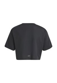 Black cropped t-shirt made of cotton with short sleeves and a round neckline. Features a small logo at the back near the hem.