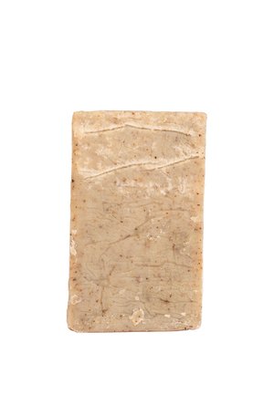 Saponetta naturale, forma rettangolare, colore beige chiaro con macchie. La superficie ha una texture liscia con linee e motivi sottili.
