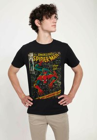 Black cotton t-shirt featuring a colorful Spider-Man comic print, including bold yellow text and intricate background characters.