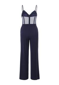 Combinaison bleu marine avec corsage en maille transparente, bordure en dentelle, bretelles spaghetti, taille cintrée et pantalon à jambes larges.