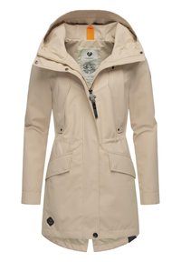 Beige waterdichte jas met een capuchon, voorrits, twee grote zijzakken en een taillekoord. Beschikt over een gladde textuur en een binnenpatroon.