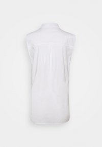 Sleeveless white shirt with a back yoke and central pleat, shown against a plain white background.