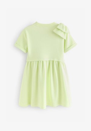 Abito in cotone verde lime con corpetto aderente, maniche corte e spalline arricciate; gonna a pieghe per una silhouette svasata.