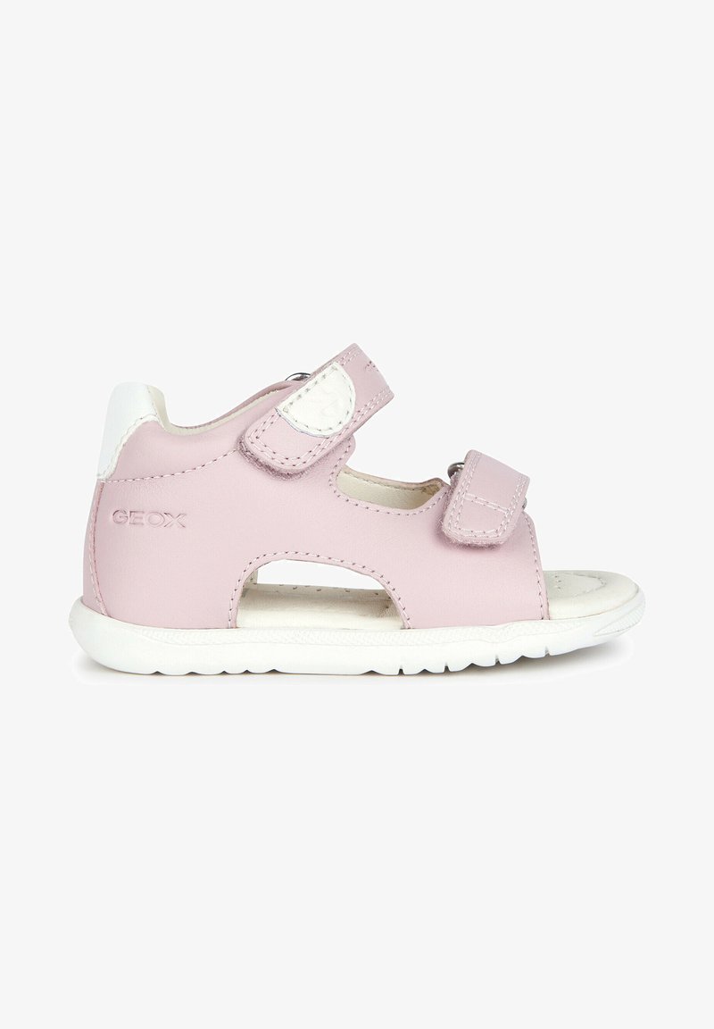 Rosa Leder-Sandale mit weißen Akzenten, ausgestattet mit zwei verstellbaren Klettverschlussriemen, einem ausgestanzten Design und einer strukturierten weißen Gummisohle.