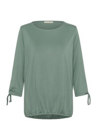 Zelený top s třičtvrtě rukávy, kulatým výstřihem a nařaseným lemem. Má zavazovací detaily na manžetách rukávů. Hladká textilie.