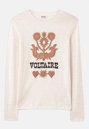 Pull crème à manches longues en matériau doux, orné d'un motif floral brun et du mot "VOLTAIRE" en noir. Texture subtile et couleur neutre.