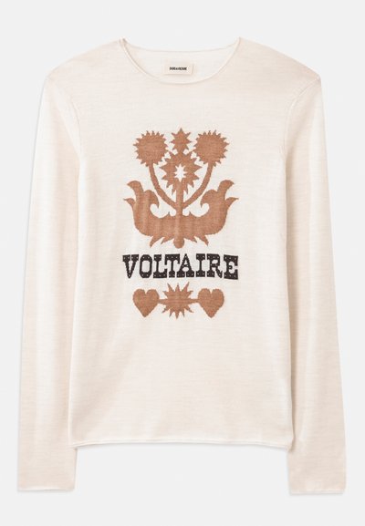 Krämfärgad långärmad tröja i mjukt material med ett brunt blommönster och ordet "VOLTAIRE" i svart. Subtil textur och neutral färg.